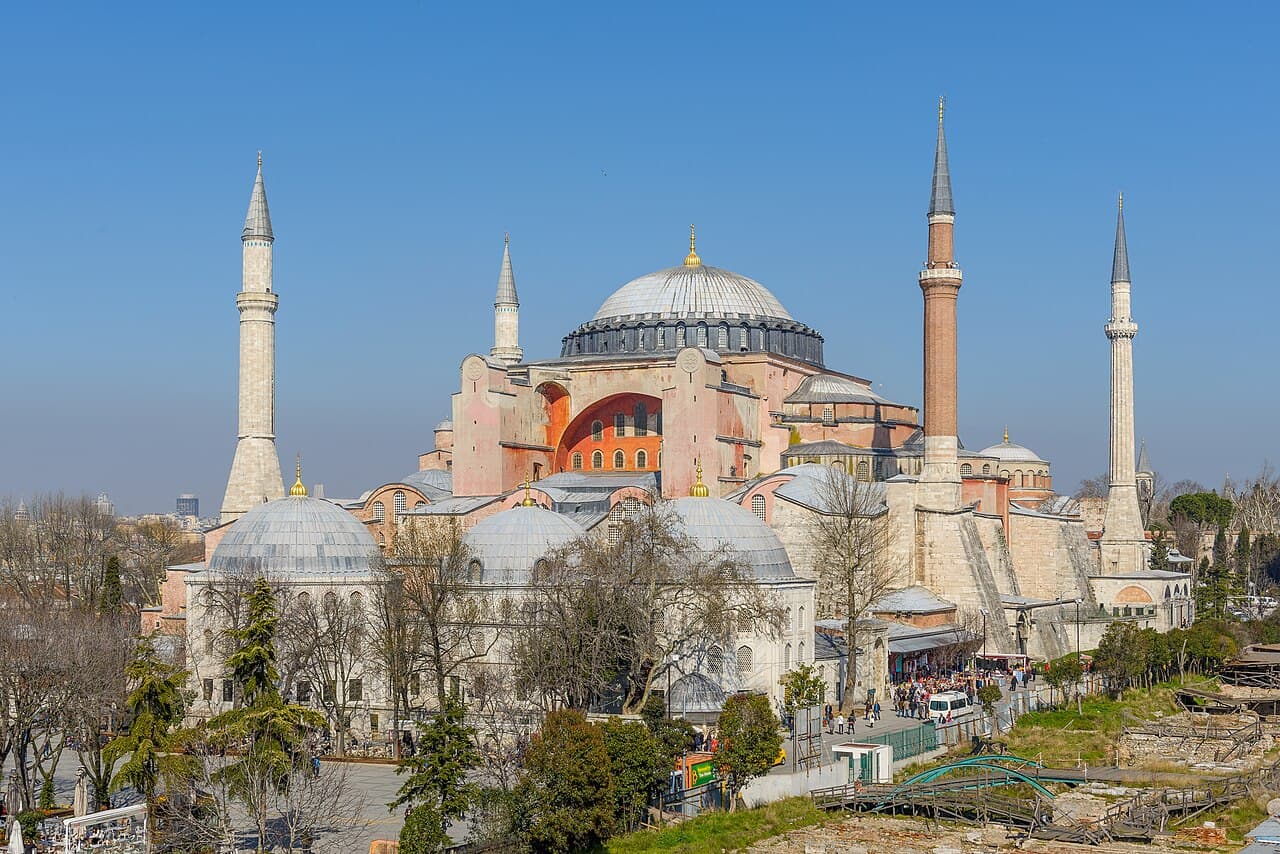 The Hagia Sophia from outside, with Sinan's 16th-century buttresses and the four Ottoman-era minarets. The core 6th-century brick walls are still in place.