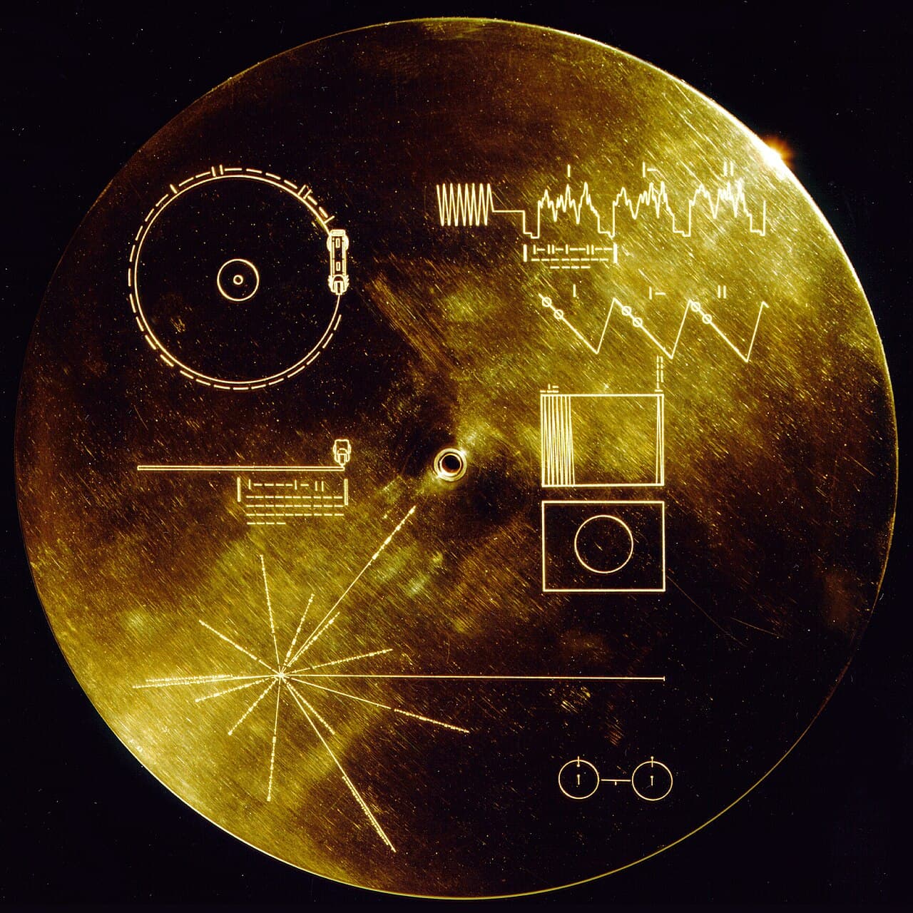 The Golden Record carried by each Voyager. 27 pieces of music, greetings in 55 languages, 116 images, and a copy of these instructions.